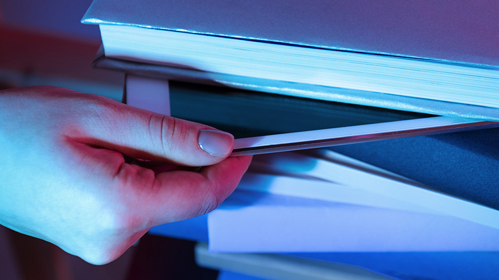 Stack of books with an iPad