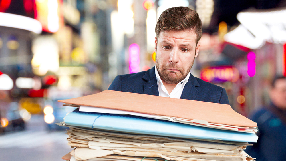 Men with a lot of old historical documents