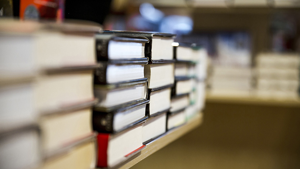 Many books in the library on the table