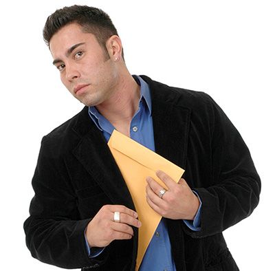 man slipping confidential files into his jacket